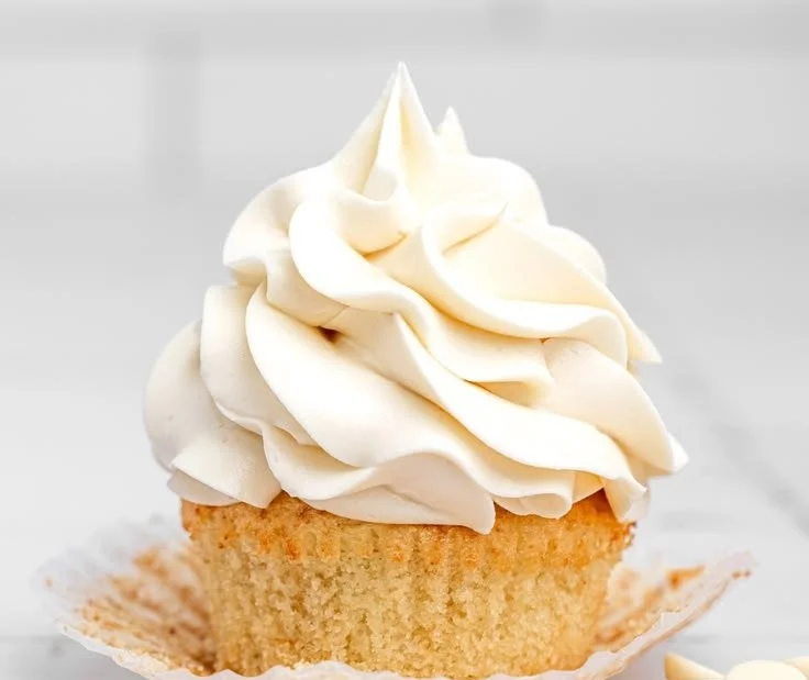 Creamy white chocolate frosting on a delicious cake