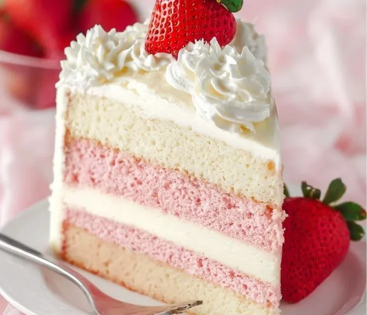 Strawberries and Cream Cheesecake Cake topped with fresh strawberries.
